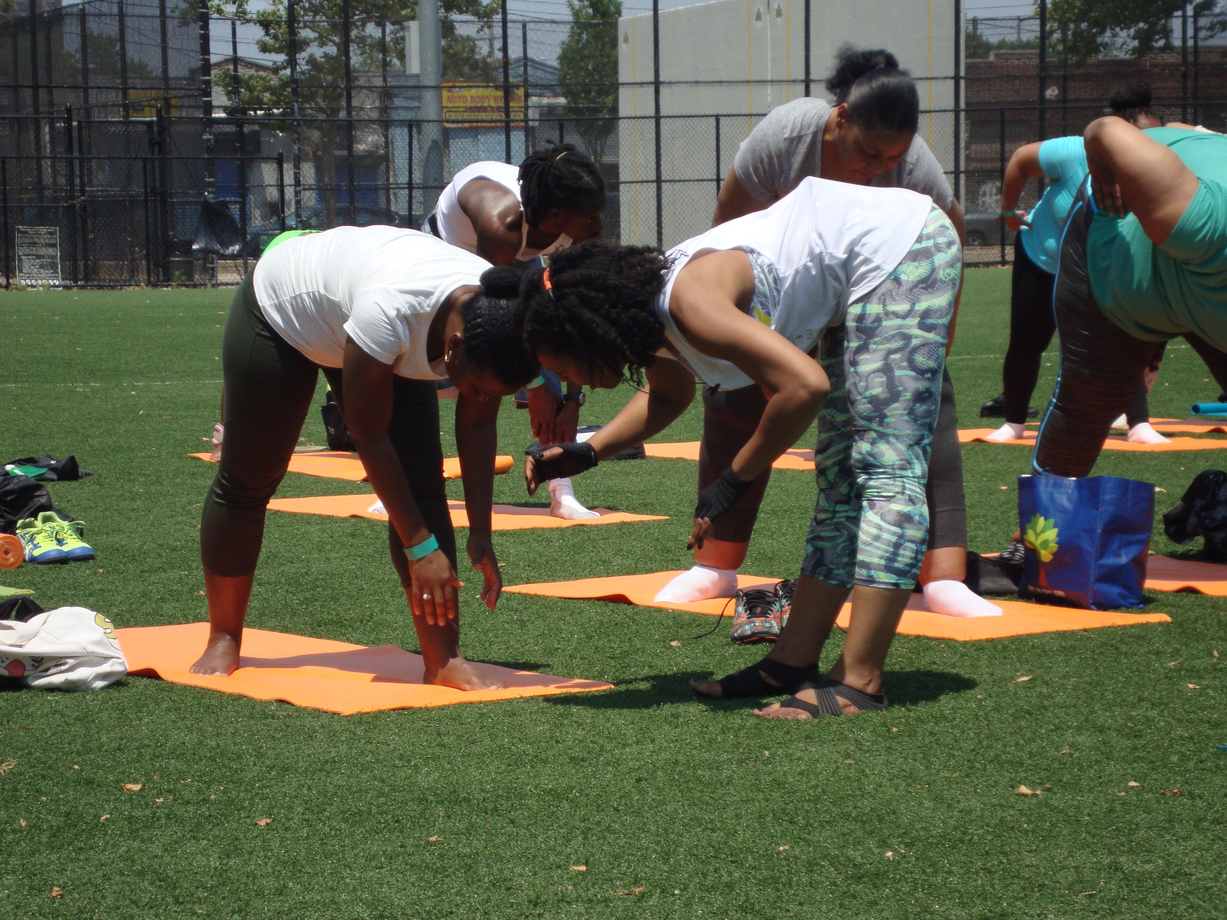 Some pose adjusting to individualize the yoga practice - Breathe Brownsville Brooklyn Yoga Festival