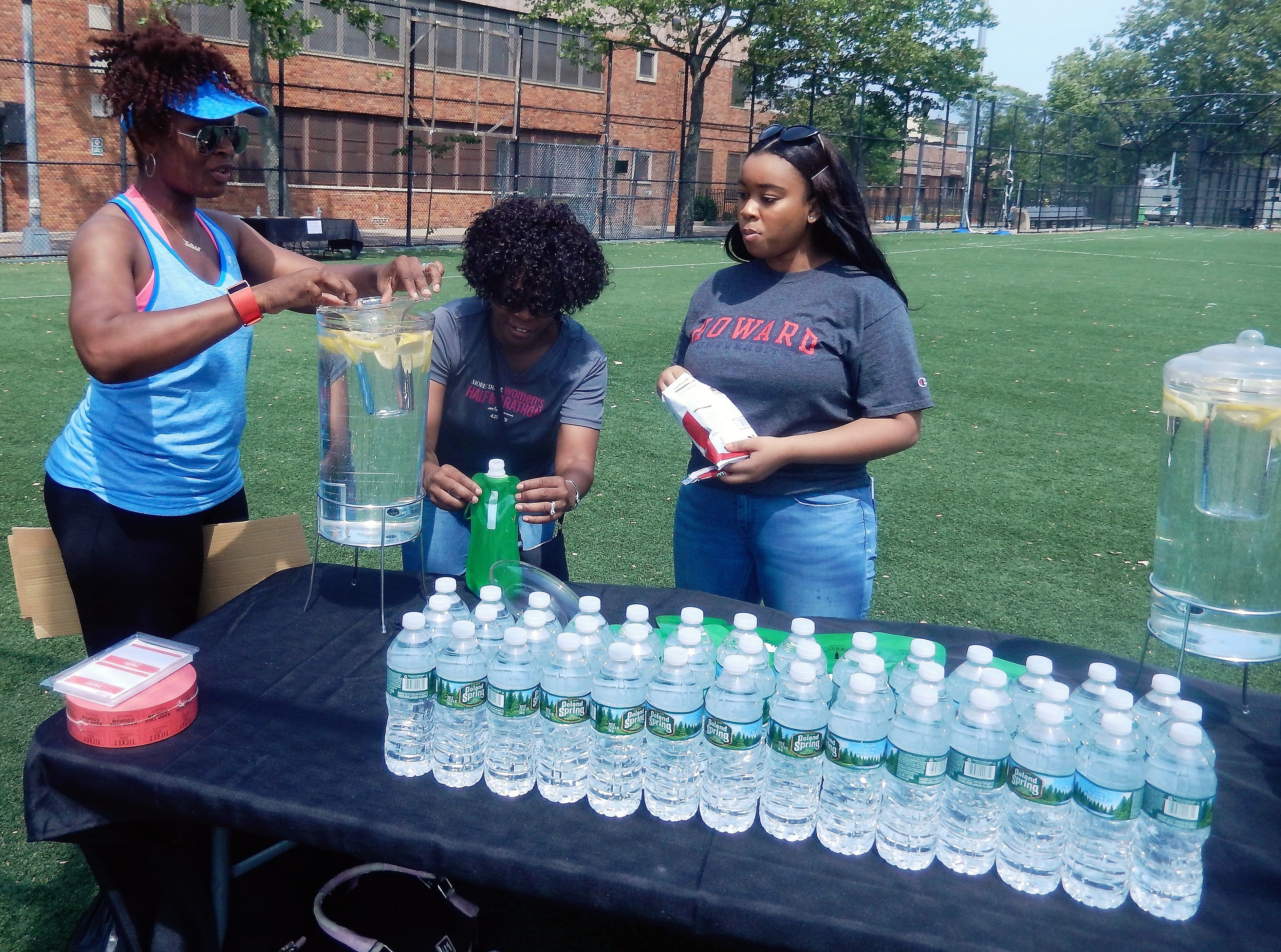 Water bottle table for yogis to stay hydrated - Breathe Brownsville Brooklyn Yoga Festival