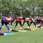 Exhaling forward into Parvottanasana pose - Breathe Brownsville Brooklyn Yoga Festival